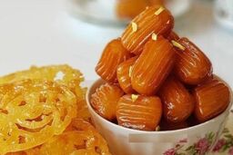طرز تهیه زولبیا با نشاسته و ماست + فوت و فن ترد شدن زولبیا و بامیه